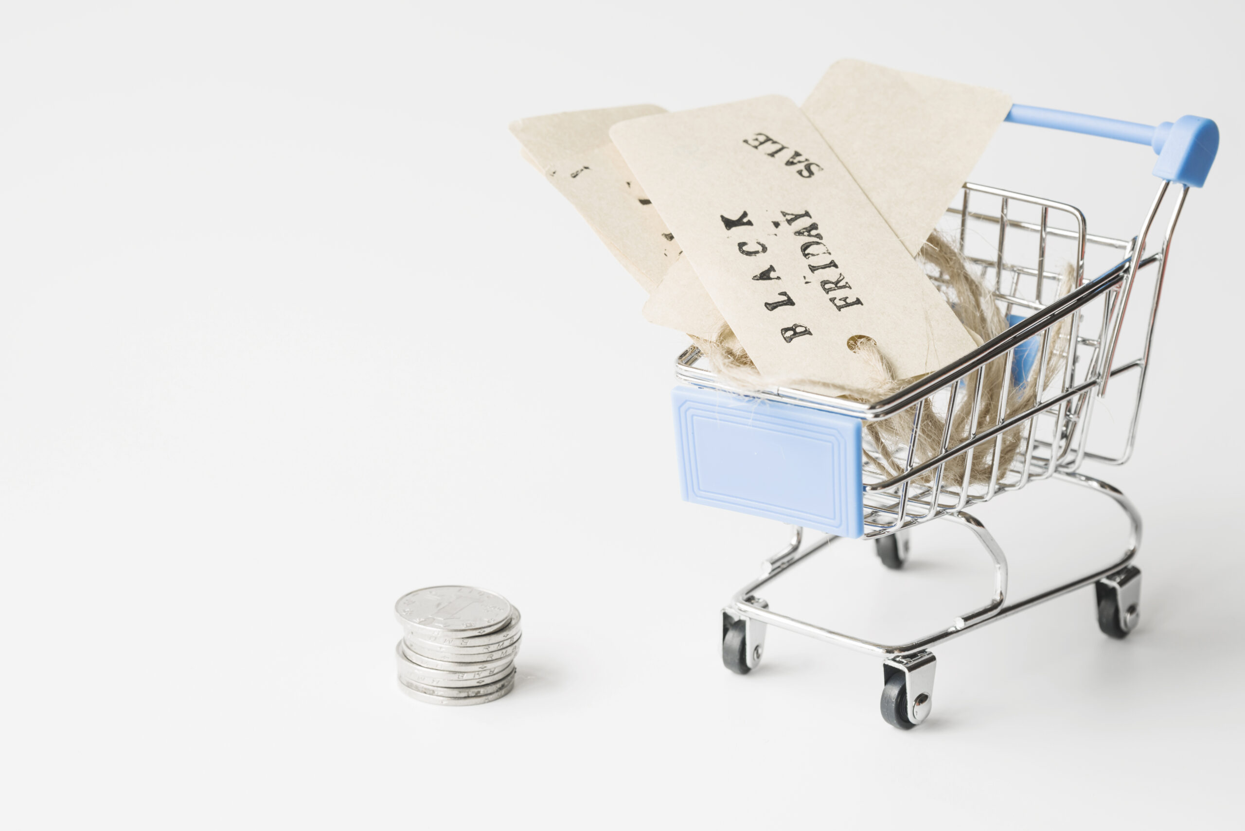 //www.freetrade4us.org/wp-content/uploads/2025/01/labels-shopping-trolley-near-coins-scaled.jpg